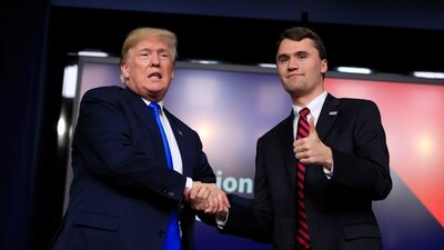 US President Donald Trump shakes hands with Charlie Kirk. (AP)
