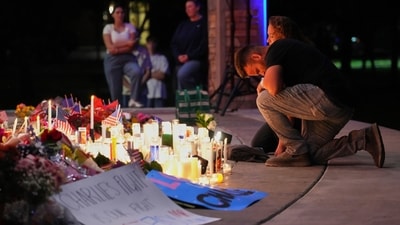 A man kneels during a vigil for Charlie Kirk, the CEO and co-founder of Turning Point USA who was shot and killed, Thursday, Sept. 11, 2025, in Orem, Utah. (AP Photo/Lindsey Wasson) (AP) A man kneels during a vigil for Charlie Kirk, the CEO and co-founder of Turning Point USA who was shot and killed, Thursday, Sept. 11, 2025, in Orem, Utah. (AP Photo/Lindsey Wasson) (AP)
