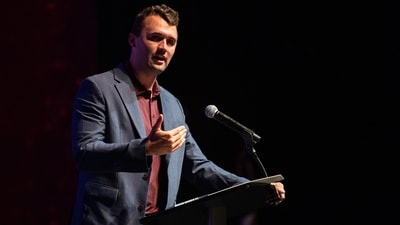 Footage revealed that hand signals from Charlie Kirk's bodyguards were intentional security measures before his assassination. (Meredith Seaver/College Station Eagle via AP, File) (AP) Footage revealed that hand signals from Charlie Kirk's bodyguards were intentional security measures before his assassination. (Meredith Seaver/College Station Eagle via AP, File) (AP)