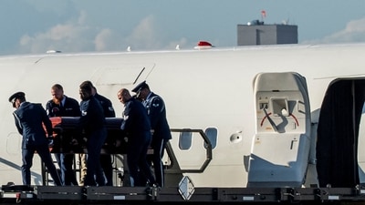 The body of slain conservative activist Charlie Kirk is carried from Air Force Two (REUTERS)