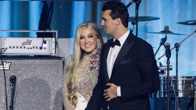 Charlie Kirk (R) and and his wife Erika Lane Frantzve (L) on stage during the Turning Point USA Inaugural-Eve Ball (Getty Images via AFP) Charlie Kirk (R) and and his wife Erika Lane Frantzve (L) on stage during the Turning Point USA Inaugural-Eve Ball (Getty Images via AFP)