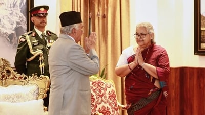 Former Supreme Court chief justice Sushila Karki, right, greets Nepalese President Ram Chandra Poudel after taking the oath as interim prime minister during a ceremony at the presidential residence in Kathmandu, Nepal on Friday. (AP) Former Supreme Court chief justice Sushila Karki, right, greets Nepalese President Ram Chandra Poudel after taking the oath as interim prime minister during a ceremony at the presidential residence in Kathmandu, Nepal on Friday. (AP)