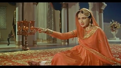 Meena Kumari in Pakeezah. “The music and film actors strewn along the narrative... aren’t throwaway references; they’re lifelines connecting mother and son. Sridevi, Meena Kumari, Sonu Nigam, and Shah Rukh Khan all play their parts; indeed, each animates the duo’s imagination as much as their professional and personal lives.” (Film still)