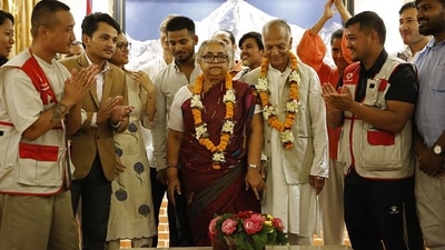 Nepal's newly appointed Prime Minister Sushila Karki (C) is congratulated by her supporters after the swearing-in-ceremony at the President House in Kathmandu on September 12, (AFP) Nepal's newly appointed Prime Minister Sushila Karki (C) is congratulated by her supporters after the swearing-in-ceremony at the President House in Kathmandu on September 12, (AFP)