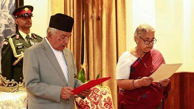 TOPSHOT - Nepal's President Ram Chandra Paudel (L) administers the oath to the country's newly appointed Prime Minister Sushila Karki during her swearing-in-ceremony at the President House in Kathmandu on September 12 (AFP) TOPSHOT - Nepal's President Ram Chandra Paudel (L) administers the oath to the country's newly appointed Prime Minister Sushila Karki during her swearing-in-ceremony at the President House in Kathmandu on September 12 (AFP)