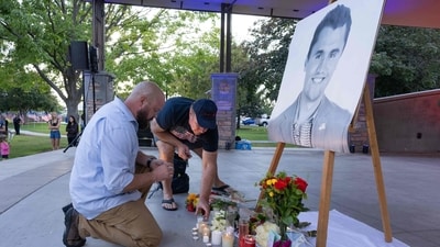 People pay their respects during a candlelight vigil for youth activist and influencer Charlie Kirk at a makeshift memorial at Orem City Center Park in Orem, Utah, a day after he was shot during a public event at Utah Valley University on September 11, 2025. (AFP) People pay their respects during a candlelight vigil for youth activist and influencer Charlie Kirk at a makeshift memorial at Orem City Center Park in Orem, Utah, a day after he was shot during a public event at Utah Valley University on September 11, 2025. (AFP)