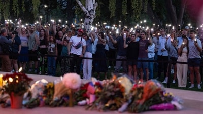 People pay their respects during a candlelight vigil for youth activist and influencer Charlie Kirk at a makeshift memorial at Orem City Center Park in Orem, Utah, a day after he was shot during a public event at Utah Valley University on September 11, 2025, waving the light from their phones. (AFP) People pay their respects during a candlelight vigil for youth activist and influencer Charlie Kirk at a makeshift memorial at Orem City Center Park in Orem, Utah, a day after he was shot during a public event at Utah Valley University on September 11, 2025, waving the light from their phones. (AFP)
