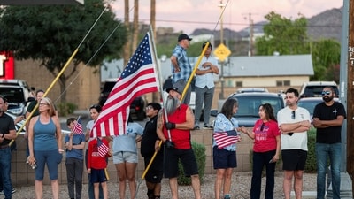 People gather outside the mortuary where the body of slain conservative activist Charlie Kirk was delivered, in Phoenix, Arizona, U.S., September 11, 2025, one day after Kirk was fatally shot during an event at Utah Valley University. REUTERS/Thomas Machowicz (REUTERS)