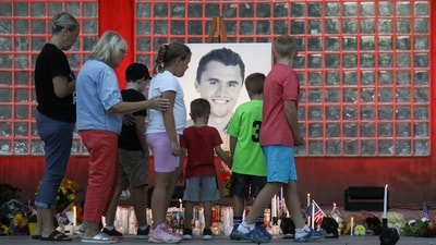 People attend a vigil at Orem City Center Park, after U.S. right-wing activist and commentator, Charlie Kirk, was fatally shot&nbsp; (Reuters)