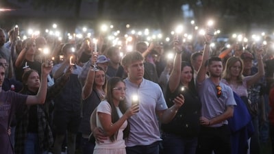 People attend a vigil at Orem City Centre Park, after U.S. right-wing activist and commentator, Charlie Kirk, an ally of U.S. President Donald Trump, was fatally shot during an event at Utah Valley University (Reuters)