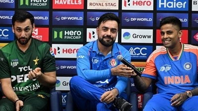 Rashid Khan sat between Salman Agha, left, and Suryakumar Yadav, right (AFP) Rashid Khan sat between Salman Agha, left, and Suryakumar Yadav, right (AFP)