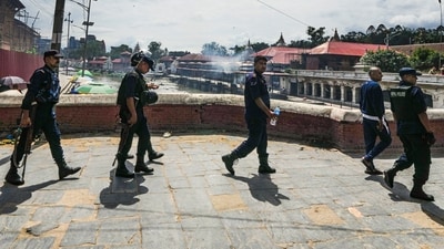 Kathmandu: Security personnel keep vigil at Pashupatinath Temple following protests, in Kathmandu (PTI) Kathmandu: Security personnel keep vigil at Pashupatinath Temple following protests, in Kathmandu (PTI)