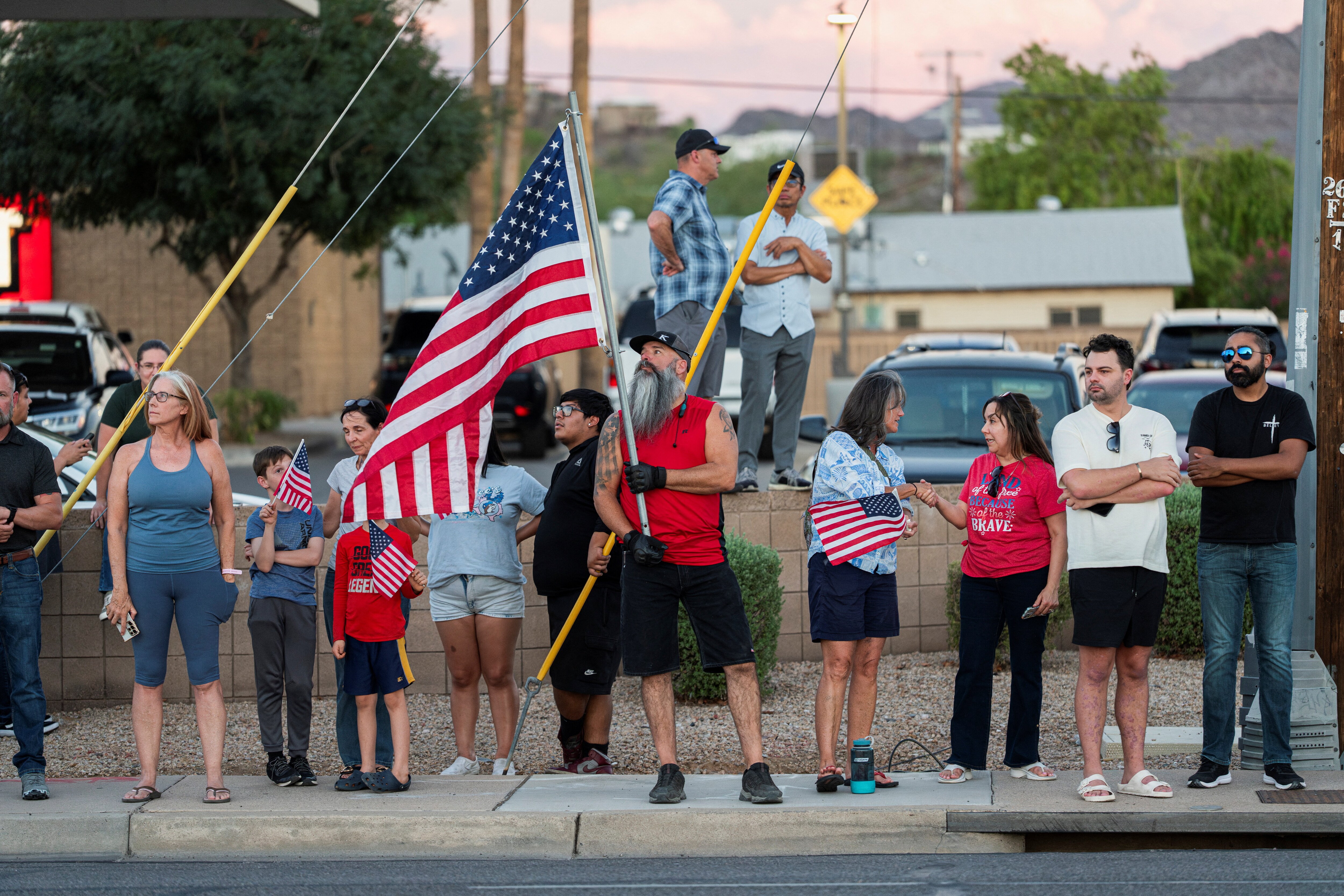 People gather outside the mortuary where the body of slain conservative activist Charlie Kirk was delivered, in Phoenix, Arizona, U.S., September 11, 2025, one day after Kirk was fatally shot during an event at Utah Valley University. (REUTERS)