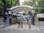 Security personnel stand guard outside the Enforcement Directorate office in New Delhi. Security personnel stand guard outside the Enforcement Directorate office in New Delhi.