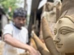 Artists working round the clock to finish the idols in time for the festivities. (Parveen Kumar/HT ) Artists working round the clock to finish the idols in time for the festivities. (Parveen Kumar/HT )
