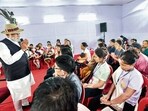 Prime Minister Narendra Modi interacts with violence-hit displaced people in Churachandpur on Saturday. (ANI)