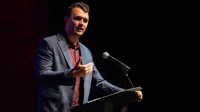 Footage revealed that hand signals from Charlie Kirk's bodyguards were intentional security measures before his assassination. (Meredith Seaver/College Station Eagle via AP, File) (AP) Footage revealed that hand signals from Charlie Kirk's bodyguards were intentional security measures before his assassination. (Meredith Seaver/College Station Eagle via AP, File) (AP)