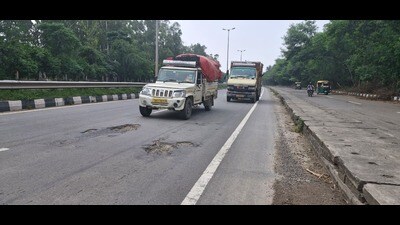 Heavy rains have left several stretches across Panchkula riddled with potholes, making commute risky and arduous. (HT)