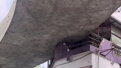 Nagpur’s Indora–Dighori flyover project has sparked a storm on social media after images showed a section of the flyover curve that appears to cut through a balcony of a house. (X Photo) Nagpur’s Indora–Dighori flyover project has sparked a storm on social media after images showed a section of the flyover curve that appears to cut through a balcony of a house. (X Photo)