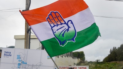 Bharat Jodo Yatra: A Congress supporter waves a party flag in Kanyakumari. (PTI) Bharat Jodo Yatra: A Congress supporter waves a party flag in Kanyakumari. (PTI)
