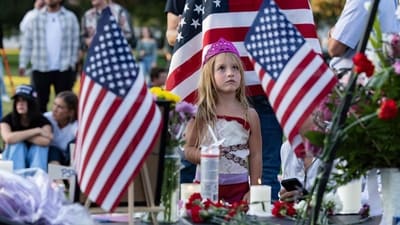 A young girl looks up at a photograph of Charlie Kirk during a candlelight vigil for the right-wing activist at a makeshift memorial at Memorial Park in Provo, Utah, on September 12, 2025. (AFP) A young girl looks up at a photograph of Charlie Kirk during a candlelight vigil for the right-wing activist at a makeshift memorial at Memorial Park in Provo, Utah, on September 12, 2025. (AFP)