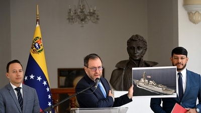 Venezuela's Foreign Minister Yvan Gil shows a picture of a boat bearing a US flag during a press conference at the Ministry of Foreign Affairs in Caracas on September 13, 2025. Venezuela on Saturday hit out at the United States for allegedly seizing a fishing boat for eight hours in its exclusive economic zone. (AFP) Venezuela's Foreign Minister Yvan Gil shows a picture of a boat bearing a US flag during a press conference at the Ministry of Foreign Affairs in Caracas on September 13, 2025. Venezuela on Saturday hit out at the United States for allegedly seizing a fishing boat for eight hours in its exclusive economic zone. (AFP)