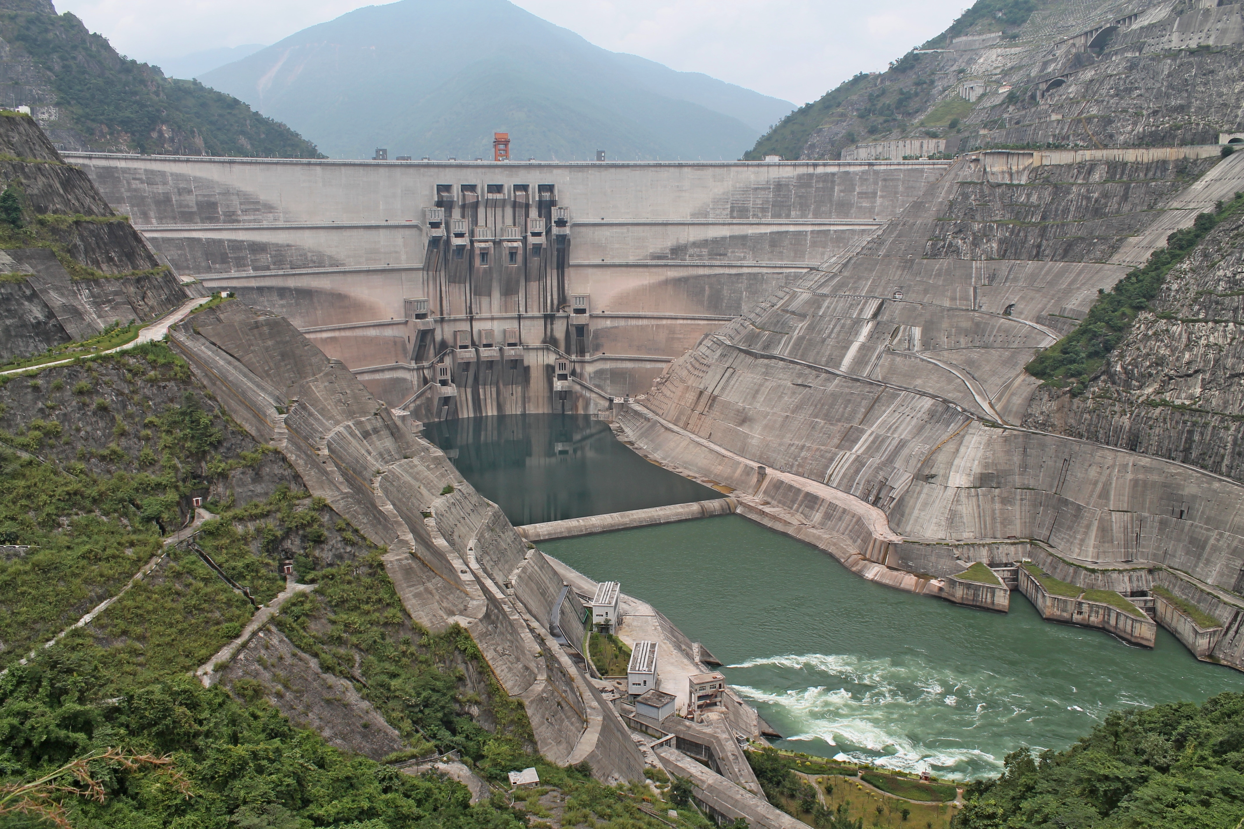 The Xiaowan Dam in the Upper Mekong, China. This 4,900-km long river, which winds from China, through Laos, Thailand, Cambodia and Vietnam, before flowing into the South China Sea, is home to the Mekong giant catfish. Dams and industrial-scale fishing along its length now block traditional routes, disrupting the fish’s feeding and spawning cycles. . (Photo: Guillaume Lacombe / Cirad) The Xiaowan Dam in the Upper Mekong, China. This 4,900-km long river, which winds from China, through Laos, Thailand, Cambodia and Vietnam, before flowing into the South China Sea, is home to the Mekong giant catfish. Dams and industrial-scale fishing along its length now block traditional routes, disrupting the fish’s feeding and spawning cycles. . (Photo: Guillaume Lacombe / Cirad)