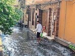 A resident wades through overflowing sewage in Ludhiana on Sunday. (Gurpreet Singh/HT) A resident wades through overflowing sewage in Ludhiana on Sunday. (Gurpreet Singh/HT)