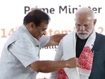 Prime Minister Narendra Modi being honored by Assam Chief Minister Himanta Biswa Sarma during the inauguration of the 2nd generation Bio-ethanol plant at Numaligarh, in Golaghat on Sunday.