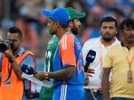 Pakistan's captain Salman Agha, rear, walks past India's captain Suryakumar Yadav after the coin toss ahead of the Asia Cup cricket match Pakistan's captain Salman Agha, rear, walks past India's captain Suryakumar Yadav after the coin toss ahead of the Asia Cup cricket match