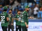 Pakistan's captain Salman Agha (R) reacts at the end of the Asia Cup 2025 Twenty20 international cricket match against India at the Dubai International Stadium in Dubai on September 14