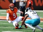 Cincinnati Bengals quarterback Joe Burrow (9) goes for the loose ball with Jacksonville Jaguars cornerback Tyson Campbell (3) 