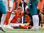 Cincinnati Bengals quarterback Joe Burrow (9) grimaces after being sacked by Jacksonville Jaguars defensive tackle Arik Armstead (91)