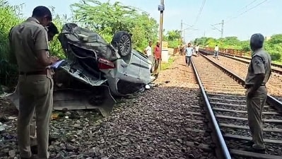 The police team found the car in an overturned condition in the tracks below the Ring Road. (ANI Video Grab) The police team found the car in an overturned condition in the tracks below the Ring Road. (ANI Video Grab)