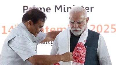 Prime Minister Narendra Modi being honored by Assam Chief Minister Himanta Biswa Sarma during the inauguration of the 2nd generation Bio-ethanol plant at Numaligarh, in Golaghat on Sunday. (DPR PMO) Prime Minister Narendra Modi being honored by Assam Chief Minister Himanta Biswa Sarma during the inauguration of the 2nd generation Bio-ethanol plant at Numaligarh, in Golaghat on Sunday. (DPR PMO)