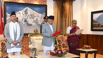 Former Supreme Court Chief Justice Sushila Karki, right, is administered the oath of office by Nepalese President Ram Chandra Poudel, centre, in Kathmandu, Nepal, Friday. (AP) Former Supreme Court Chief Justice Sushila Karki, right, is administered the oath of office by Nepalese President Ram Chandra Poudel, centre, in Kathmandu, Nepal, Friday. (AP)
