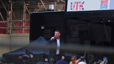 Tommy Robinson speaks during the Unite the Kingdom march and rally near Westminster, London. (AP) Tommy Robinson speaks during the Unite the Kingdom march and rally near Westminster, London. (AP)