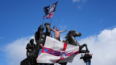 People demonstrate during the Tommy Robinson-led Unite the Kingdom march and rally in London. (AP) People demonstrate during the Tommy Robinson-led Unite the Kingdom march and rally in London. (AP)