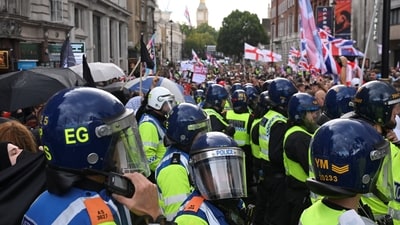 Police stationed near the anti-immigration protest in London, Britain on Saturday (Reuters)