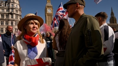 Protesters dressed up with flags to attend an anti-immigration rally organised in London, Britain (Reuters)