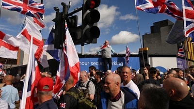 Protesters carrying English and British flags crossed Westminster Bridge before gathering near Downing Street for speeches&nbsp; (Reuters)
