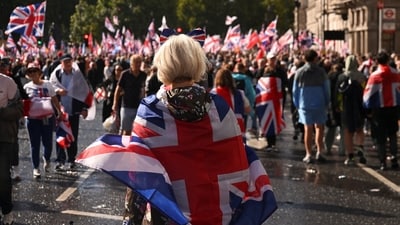 A protester wears the Union Jack flag during an anti-immigration rally in London on September 13 (Reuters)