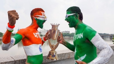 Fans with their bodies painted in national flags of India (L) and Pakistan pose in Ahmedabad on September 13, 2025, with a replica of the Asia Cup 2025 trophy on the eve of the Twenty20 international cricket match between India and Pakistan in Dubai. (AFP) Fans with their bodies painted in national flags of India (L) and Pakistan pose in Ahmedabad on September 13, 2025, with a replica of the Asia Cup 2025 trophy on the eve of the Twenty20 international cricket match between India and Pakistan in Dubai. (AFP)