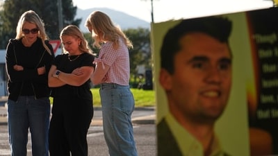 Women pray at a memorial outside Utah Valley University after Turning Point USA CEO and co-founder Charlie Kirk was shot and killed, Saturday, Sept. 13, 2025, in Orem, Utah. (AP Photo/Lindsey Wasson) (AP) Women pray at a memorial outside Utah Valley University after Turning Point USA CEO and co-founder Charlie Kirk was shot and killed, Saturday, Sept. 13, 2025, in Orem, Utah. (AP Photo/Lindsey Wasson) (AP)