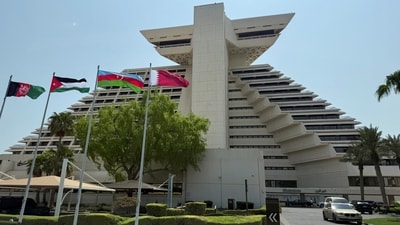Flags of Afghanistan, Jordan, Azerbaijan and Qatar flutter as Qatar prepares to host the Emergency Arab-Islamic Summit at the Sheraton Hotel, in Doha, Qatar. (REUTERS)