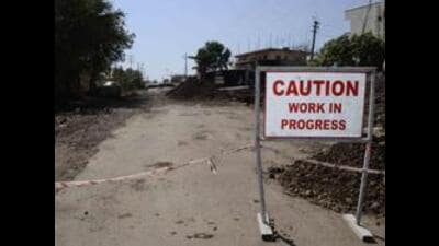 Meanwhile, the existing road too is riddled with potholes. The MIDC has begun patchwork but residents say temporary fixes are no substitute for a proper asphalted road. (HT)
