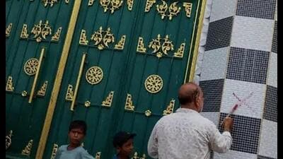 The revenue department team marking the alleged illegal structure. (HT)