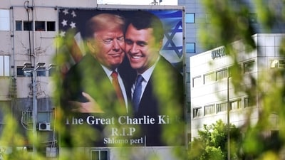 A billboard showing an image of US President Donald Trump (L) embracing US prominent right-wing activist Charlie Kirk (AFP) A billboard showing an image of US President Donald Trump (L) embracing US prominent right-wing activist Charlie Kirk (AFP)