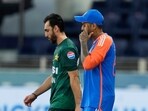 India's captain Suryakumar Yadav, right, and Pakistan's captain Salman Agha walk onto the field before the start of the Asia Cup cricket match