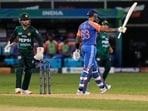 India's captain Suryakumar Yadav raises his bat to celebrate their win in the Asia Cup cricket match against Pakistan.